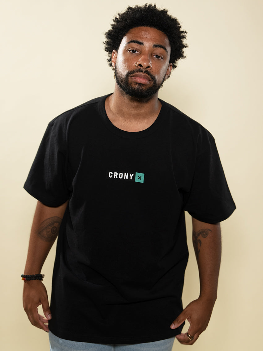 Male model wearing black CRONY X branded tee. These are made of premium, organic cotton giving it a soft, comfortable feel