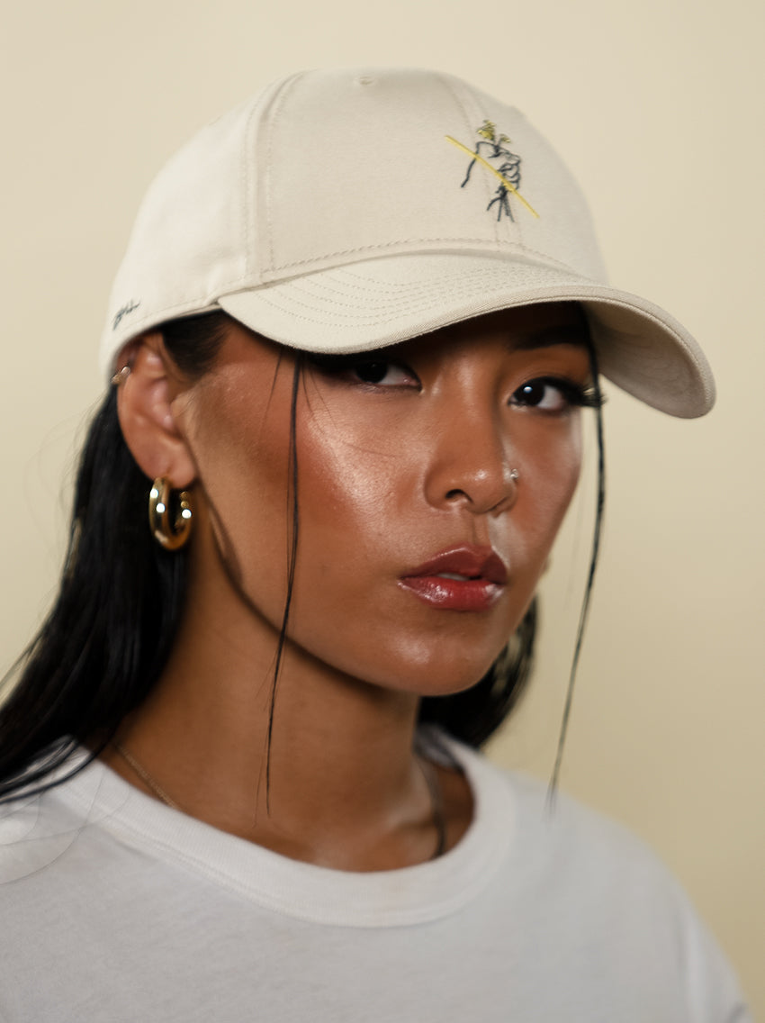 Female model showcasing Do Not Pick Them recycled dad hat