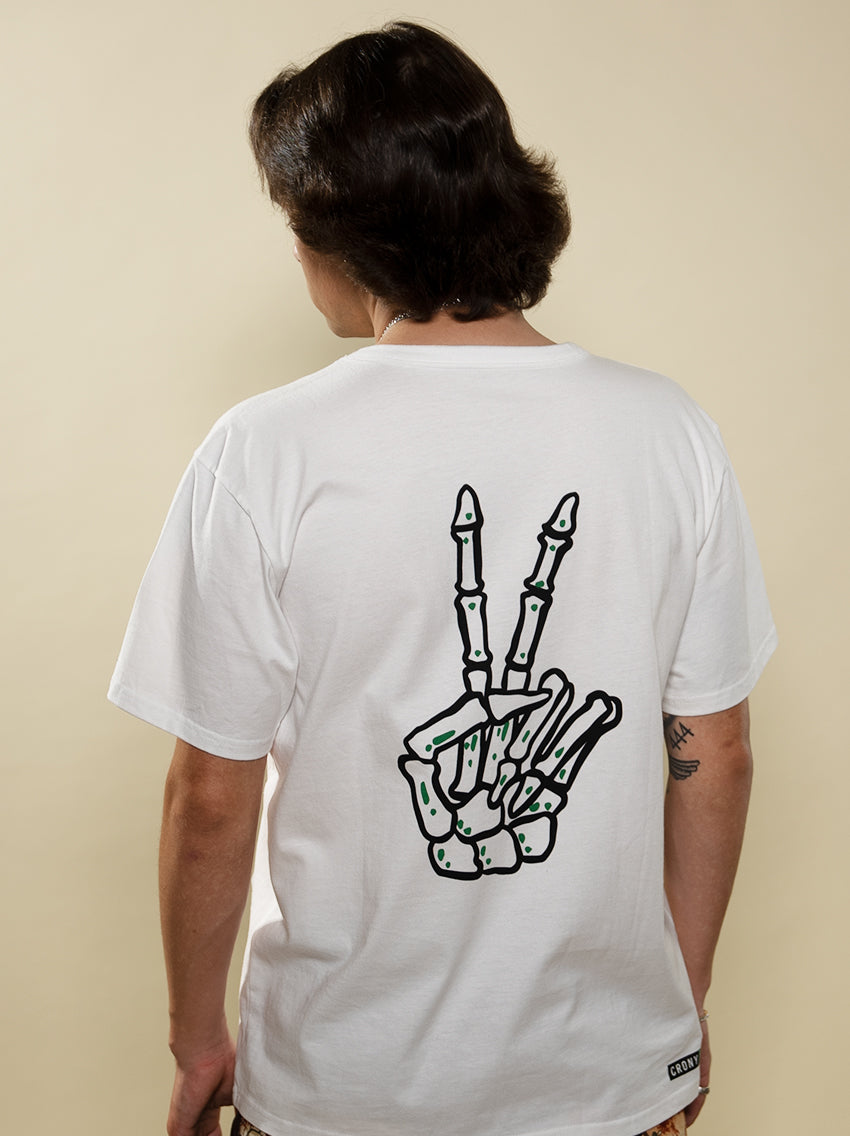 Full back side view of the white Peace In Death tee with large skeletal peace sign. This tee is made from high quality organic cotton to give it a soft and comfortable feel