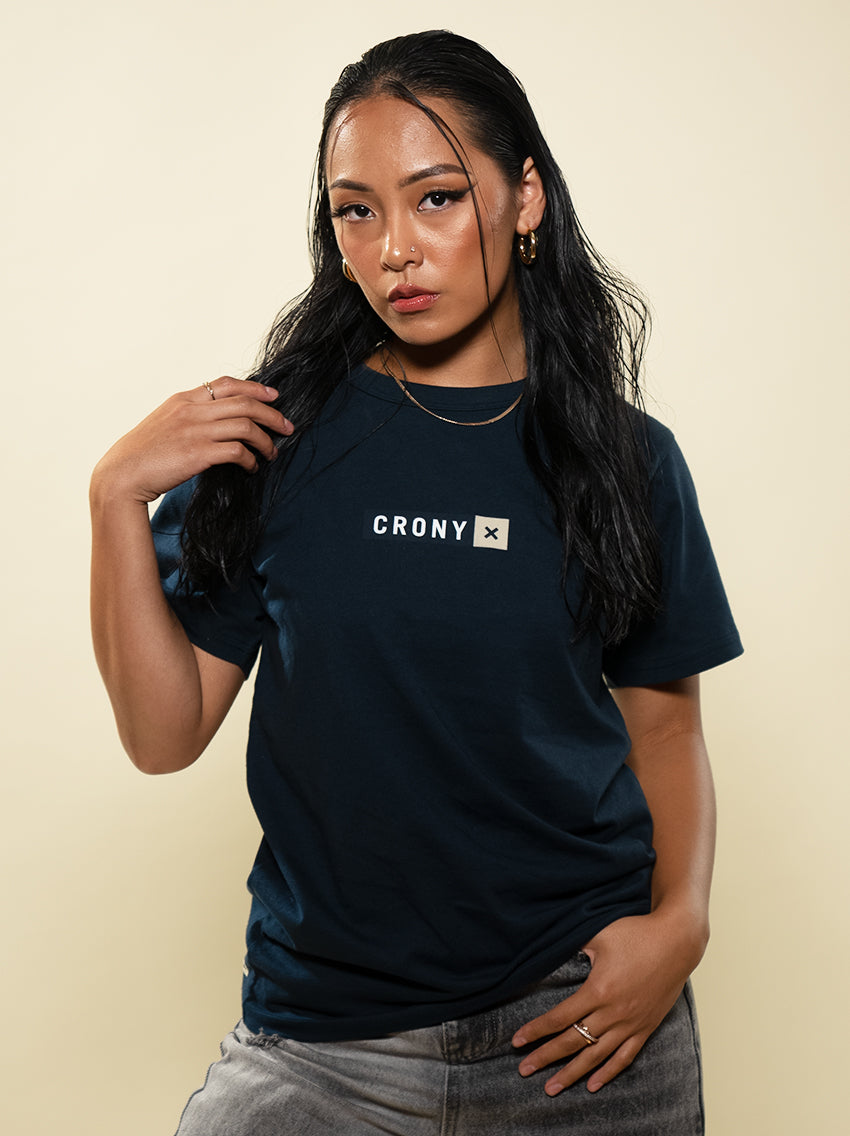 Female model wearing navy CRONY X branded tee. These are made of premium, organic cotton giving it a soft, comfortable feel